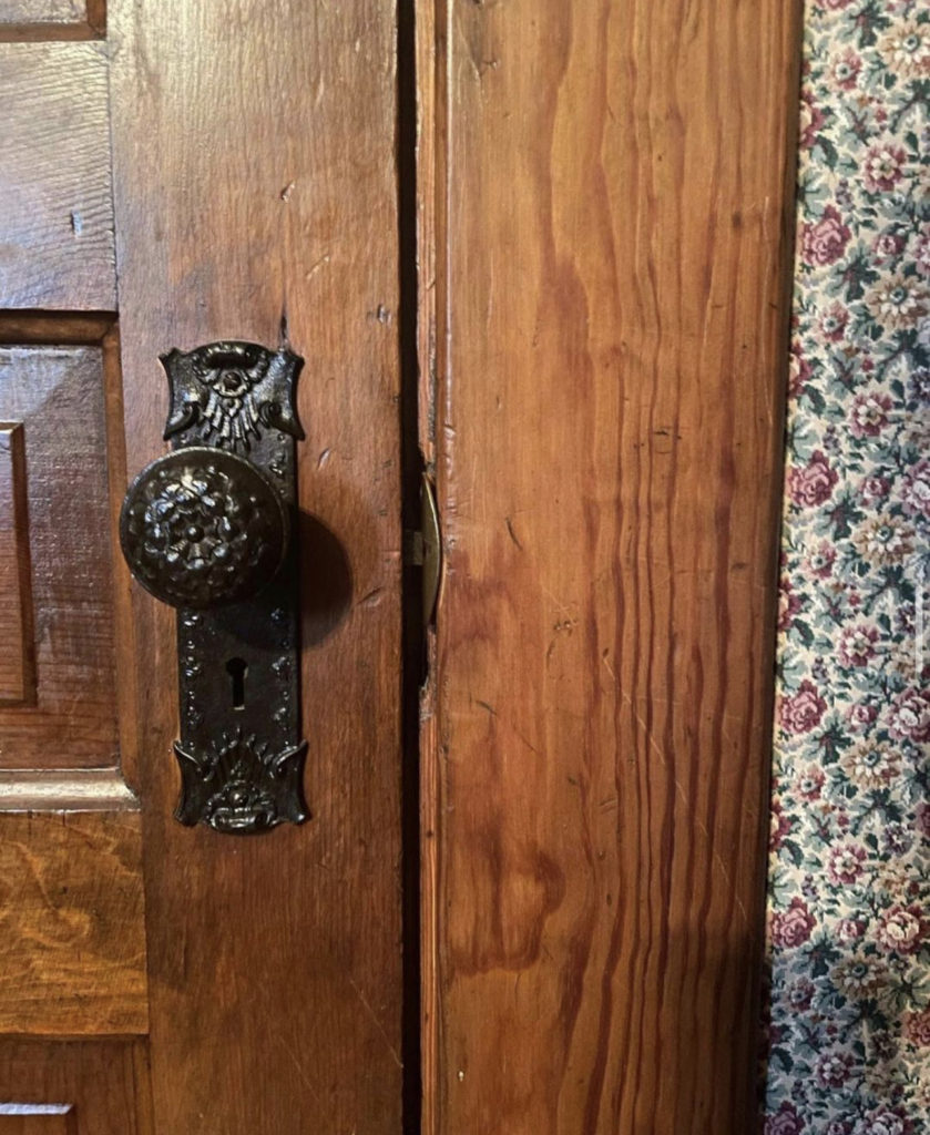 An antique doorknob in a Victorian house.