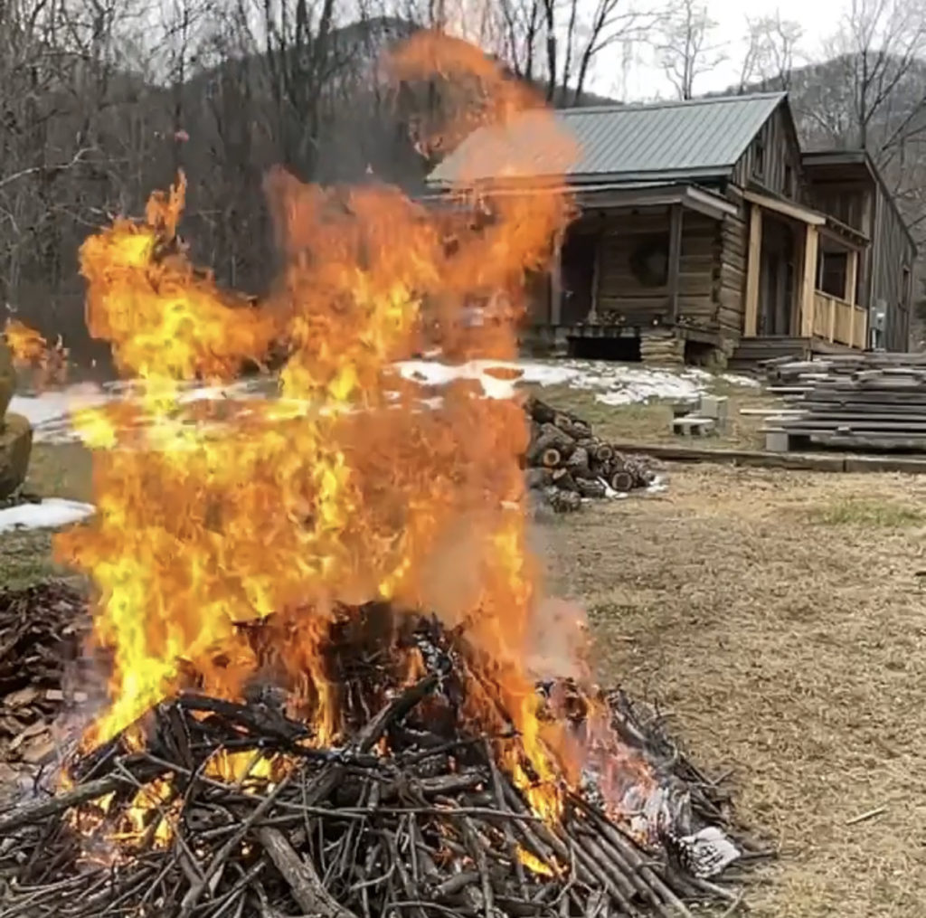 A big bonfire outside the cozy cabin.