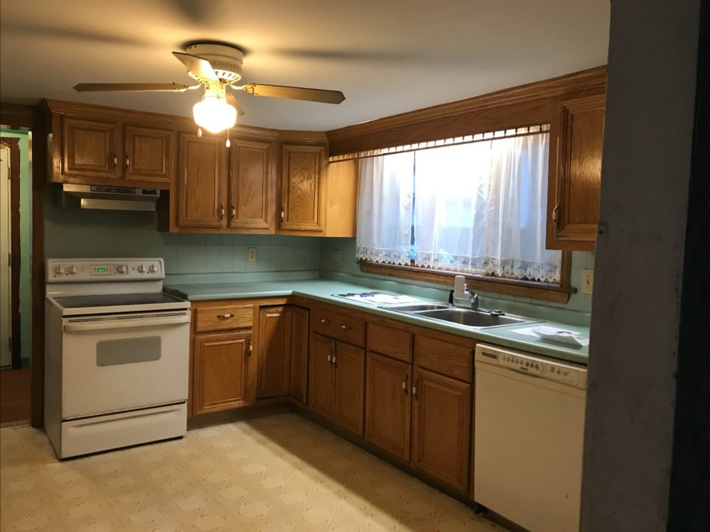 A picture of an 80s style kitchen before a renovation.