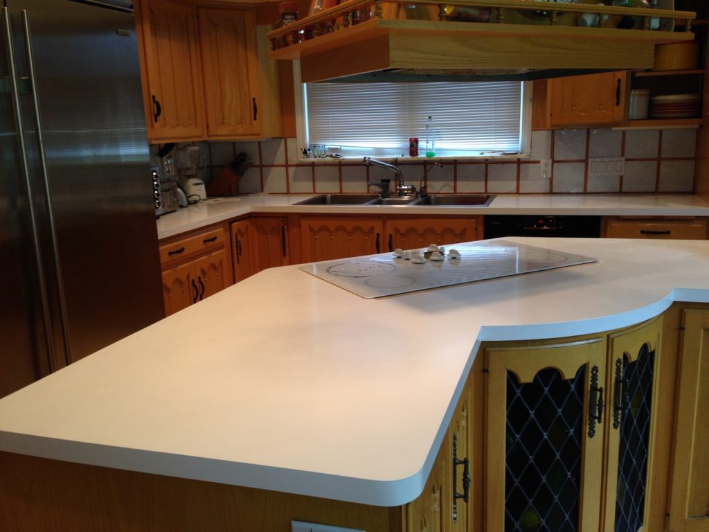 The kitchen counter before renovation. The countertop is white.