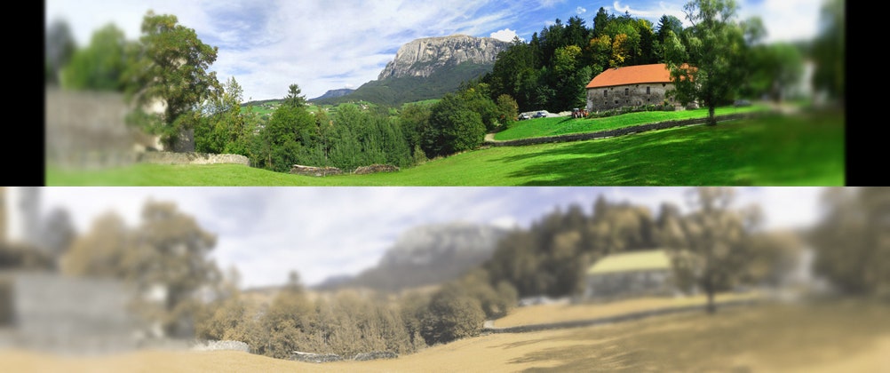 Two versions of the same landscape. One has normal colors, and the other is blurred out of focus except for in the very middle and is dim, with only blue and green tones visible.